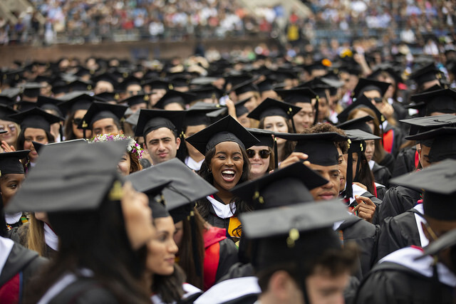 Graduates in regalia on Franklin Field