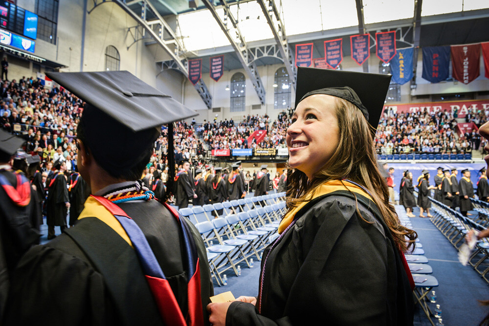 school commencement ceremony with Wharton student gazing up