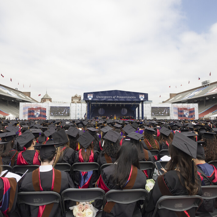 graduates watching ceremony on Franklin Field